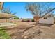 The backyard features a covered patio, a detached storage shed, and block fencing at 5029 N 86Th Dr, Glendale, AZ 85305