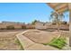 The backyard features a storage shed, block fencing, and a curved sidewalk to the house at 5029 N 86Th Dr, Glendale, AZ 85305