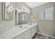 Bathroom features a double sink vanity, large mirror with lighting, and neutral walls at 5029 N 86Th Dr, Glendale, AZ 85305