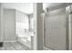 Bright bathroom featuring a tub and shower with glass door, and neutral tile flooring at 5029 N 86Th Dr, Glendale, AZ 85305
