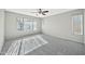 Bedroom featuring carpet flooring, ceiling fan and natural light at 5029 N 86Th Dr, Glendale, AZ 85305
