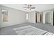 A bedroom featuring a ceiling fan, carpet flooring and natural light at 5029 N 86Th Dr, Glendale, AZ 85305