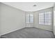 A bedroom featuring natural light, carpet flooring and light gray walls at 5029 N 86Th Dr, Glendale, AZ 85305