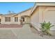 Inviting front entryway featuring desert landscaping, a covered porch, and a secure screen door at 5029 N 86Th Dr, Glendale, AZ 85305