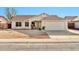 Charming single-story home featuring a two-car garage and a low maintenance desert landscaped front yard at 5029 N 86Th Dr, Glendale, AZ 85305