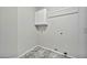 Laundry room has overhead cabinet, tile floor, and hookups for laundry machines at 5029 N 86Th Dr, Glendale, AZ 85305