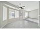 Bright living room featuring tile floors, large windows, and a ceiling fan at 5029 N 86Th Dr, Glendale, AZ 85305