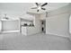 Bright living area with an open floor plan connecting to the kitchen and dining area at 5029 N 86Th Dr, Glendale, AZ 85305
