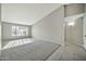 Spacious room with plush gray carpet, large window letting in light, and neutral paint at 5029 N 86Th Dr, Glendale, AZ 85305