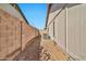 The side yard is gravel filled and features a block wall and an air conditioning unit at 5029 N 86Th Dr, Glendale, AZ 85305