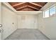The storage room features unfinished walls, a concrete floor, and a single window at 5029 N 86Th Dr, Glendale, AZ 85305