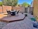 Spacious backyard featuring a cozy deck with outdoor seating, creating an inviting outdoor space at 5436 W Chisum Trl, Phoenix, AZ 85083
