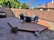 Comfortable backyard showcasing a wooden deck with outdoor seating, perfect for enjoying quiet moments at 5436 W Chisum Trl, Phoenix, AZ 85083
