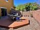 A beautifully landscaped backyard with a well-maintained deck perfect for outdoor seating and entertaining at 5436 W Chisum Trl, Phoenix, AZ 85083