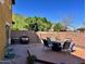 Inviting backyard featuring a wooden deck with outdoor seating, ideal for relaxing or hosting gatherings at 5436 W Chisum Trl, Phoenix, AZ 85083