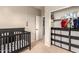Bright Bedroom with a crib, shelving unit, closet and window for natural light at 5436 W Chisum Trl, Phoenix, AZ 85083