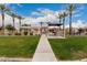 Exterior view of community building with picnic area, grill, and palm trees at 5436 W Chisum Trl, Phoenix, AZ 85083