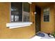 Covered entry with stylish front door, window, exterior wall texture, and lighting at 5436 W Chisum Trl, Phoenix, AZ 85083