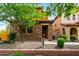 Charming two-story home featuring a stone facade and low maintenance desert landscaping at 5436 W Chisum Trl, Phoenix, AZ 85083