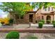 Charming two-story home featuring a stone facade and low maintenance desert landscaping at 5436 W Chisum Trl, Phoenix, AZ 85083