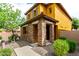 Charming two-story home featuring a stone facade, low maintenance desert landscaping, and covered entry at 5436 W Chisum Trl, Phoenix, AZ 85083