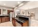 Modern kitchen showcasing stainless steel appliances, dark countertops, and ample natural light at 5436 W Chisum Trl, Phoenix, AZ 85083