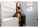 Bright laundry room with washer, dryer, shelving unit and window for natural light at 5436 W Chisum Trl, Phoenix, AZ 85083