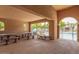 Covered patio area with picnic tables offers a relaxing poolside retreat at 5436 W Chisum Trl, Phoenix, AZ 85083