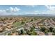 Scenic aerial shot highlighting the neighborhood's single-Gathering homes, mountain views, and lush green spaces at 5719 E Paradise Ln, Scottsdale, AZ 85254