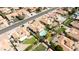 Community aerial showcases the house with a private pool, mature landscaping, and neighborhood streets at 5719 E Paradise Ln, Scottsdale, AZ 85254