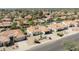 Neighborhood aerial view featuring the home's desert landscaping, mature trees and well-maintained exterior at 5719 E Paradise Ln, Scottsdale, AZ 85254