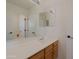 Bathroom featuring double mirrored medicine cabinets and a oak vanity at 5719 E Paradise Ln, Scottsdale, AZ 85254