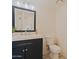Bathroom with shiplap accent wall and a dark blue vanity at 5719 E Paradise Ln, Scottsdale, AZ 85254