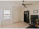Bedroom featuring wood floors, closet doors, and a ceiling fan at 5719 E Paradise Ln, Scottsdale, AZ 85254