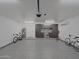 Spacious garage featuring epoxy flooring, custom cabinets, and bike work station at 5719 E Paradise Ln, Scottsdale, AZ 85254