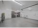 Bright garage showing epoxy flooring, custom cabinets and work station at 5719 E Paradise Ln, Scottsdale, AZ 85254