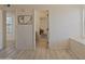 Hallway featuring laminate floors and natural light at 5719 E Paradise Ln, Scottsdale, AZ 85254