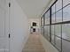 Bright hallway featuring wood floors and a fireplace at 5719 E Paradise Ln, Scottsdale, AZ 85254