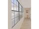 Bright hallway featuring wood floors and modern windows at 5719 E Paradise Ln, Scottsdale, AZ 85254
