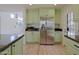 Bright kitchen with stainless steel refrigerator, plenty of storage and granite countertops at 5719 E Paradise Ln, Scottsdale, AZ 85254