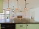 Bright kitchen with a peninsula island that flows to the spacious living room at 5719 E Paradise Ln, Scottsdale, AZ 85254