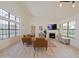 Cozy living room with a fireplace, large windows, and modern decor at 5719 E Paradise Ln, Scottsdale, AZ 85254
