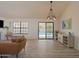 Light-filled living room with stylish furniture, backyard view, and contemporary design at 5719 E Paradise Ln, Scottsdale, AZ 85254
