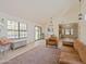 Light-filled living room featuring light wood floors, large windows, and comfortable seating at 5719 E Paradise Ln, Scottsdale, AZ 85254