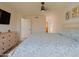 Comfortable bedroom with neutral tones, a ceiling fan, and ample space, offering a peaceful and inviting atmosphere at 5719 E Paradise Ln, Scottsdale, AZ 85254