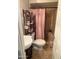 Well-maintained bathroom featuring a step-in shower and classic white vanity at 5815 N 61St Ln, Glendale, AZ 85301