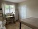 This room features a window, a sewing machine and an ironing board at 5815 N 61St Ln, Glendale, AZ 85301