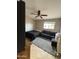 This bedroom features a ceiling fan, a window and comfortable seating at 5815 N 61St Ln, Glendale, AZ 85301