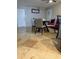 Cozy dining area with table and chairs adjacent to a living space at 5815 N 61St Ln, Glendale, AZ 85301