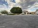 Charming single-Gathering home featuring a well-maintained front yard and private driveway at 5815 N 61St Ln, Glendale, AZ 85301